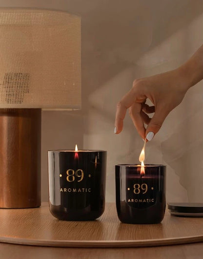 Aromatic 89 soy wax candle burning in a home interior