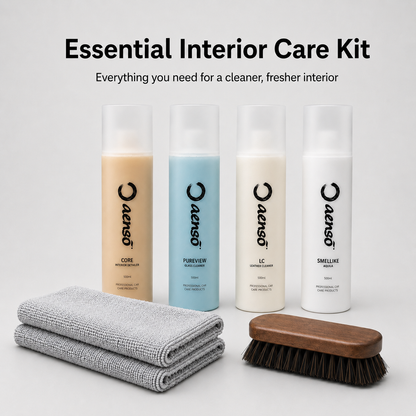 Essential interior care kit with cleaning products and tools on a white background