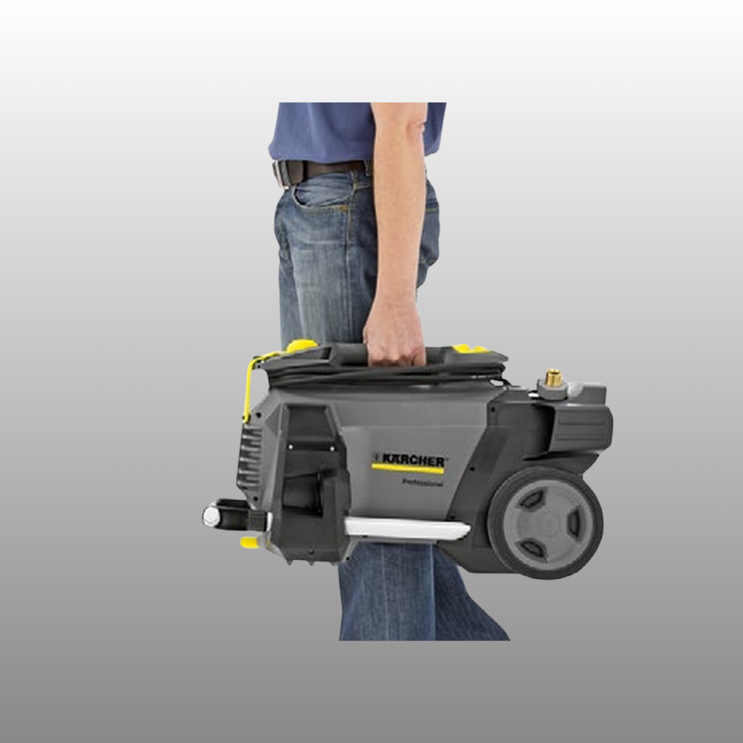 Person holding a Karcher pressure washer on a gray background