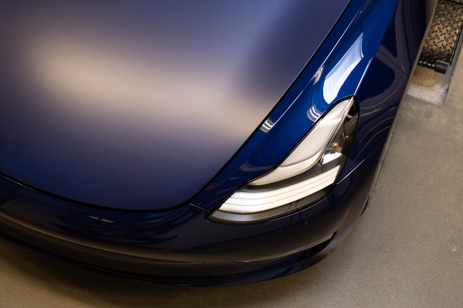 STEK DYNOmatte self-healing paint protection film installed on bonnet and compared with gloss paint