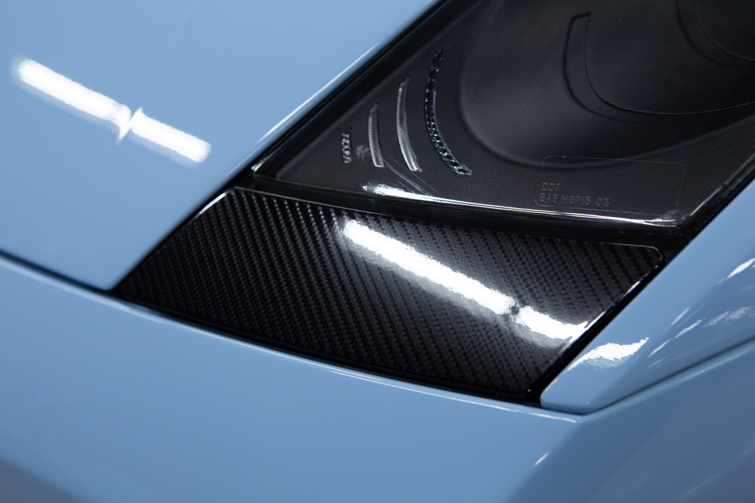 Gloss carbon fibre PPF installed on vehicle panel